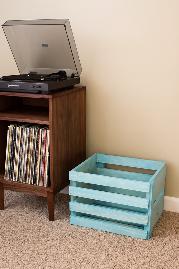 LP holder crate in Vintage Blue finish beside stereo stand