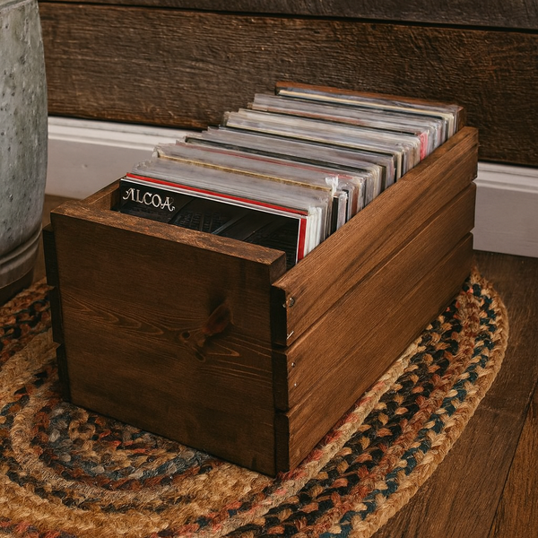 Rustic medium 45 RPM record crate with vinyl records on braided rug