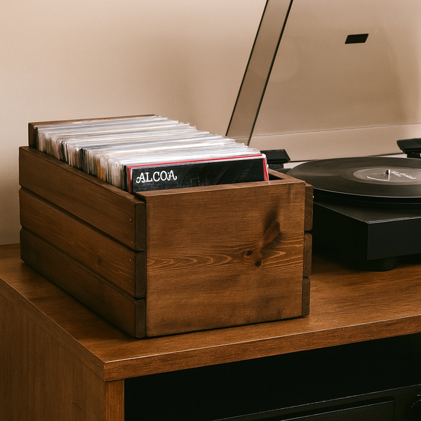 Medium 45 RPM record crate filled with vinyl records next to turntable