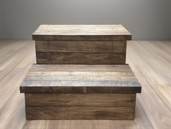 Medium brown stained wooden 2-step stool isolated in a clean studio environment.
