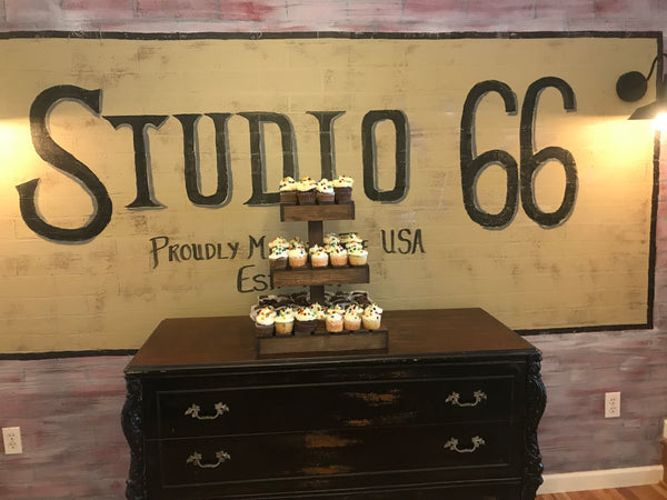 Medium rustic wooden cupcake stand with cupcakes displayed at Studio 66.