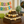 Rustic medium-stained wooden cupcake stand with cupcakes at a retirement party