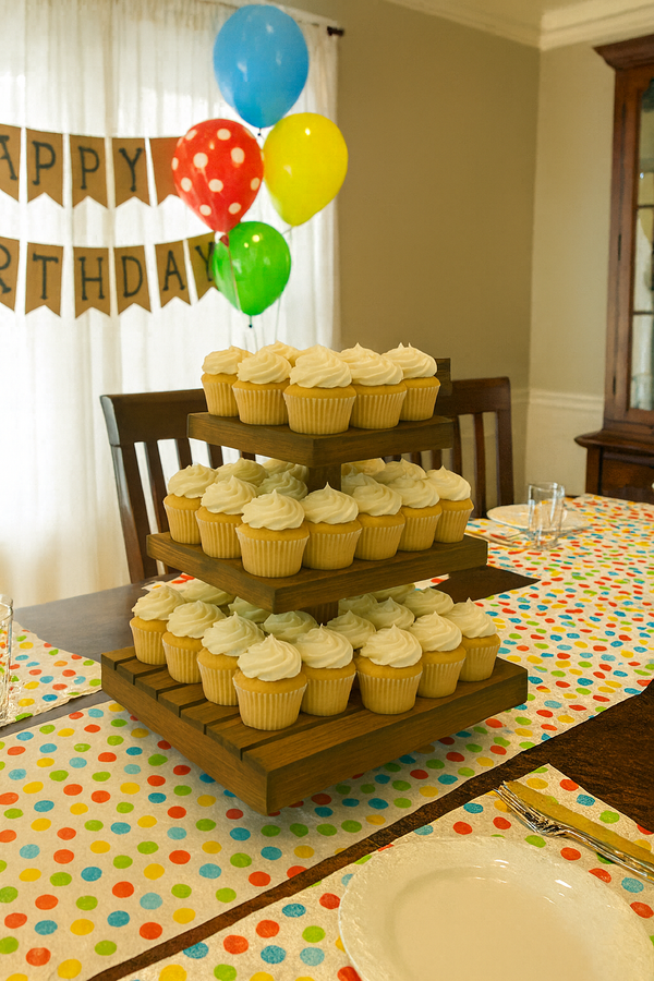 Medium rustic wooden cupcake stand decorated with cupcakes for an event or party.