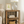 ustic medium end table styled with lamp, frame, and woven basket in cozy home setting.