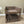 Tabletop view of farmhouse pet bunk bed in medium brown stain
