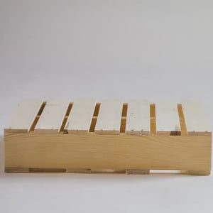 Video showcasing rustic wooden pallet stand for plants or home décor