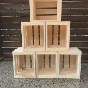 Video showcasing six natural unfinished wooden crates used for rustic farmhouse storage and decorative display.