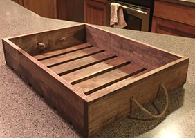 Medium brown wooden serving tray with rustic design, farmhouse décor and versatile home organizer.