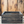 Small dark farmhouse crate against wood wall background, rustic storage box.