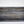 Top view of rustic small gray wooden tray with slatted wood bottom.