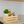 Small wooden crate in kitchen holding oil and spice jars
