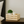 Natural wood crate on nightstand with candle and plant decor