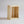 Small natural unfinished wooden crate standing upright on white background