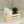 Small natural wooden storage crate used as a bathroom organizer with towels and soap