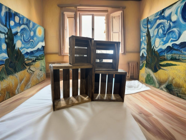 Rustic small nesting crates styled as farmhouse décor in an artistic room with painted walls.