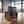 Rustic small nesting crates arranged on the floor of a modern industrial loft space.