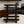 Rustic wooden spice rack in Vintage Dark finish with 5-tier slatted shelves