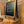Side angle view of rustic tabletop easel with chalkboard