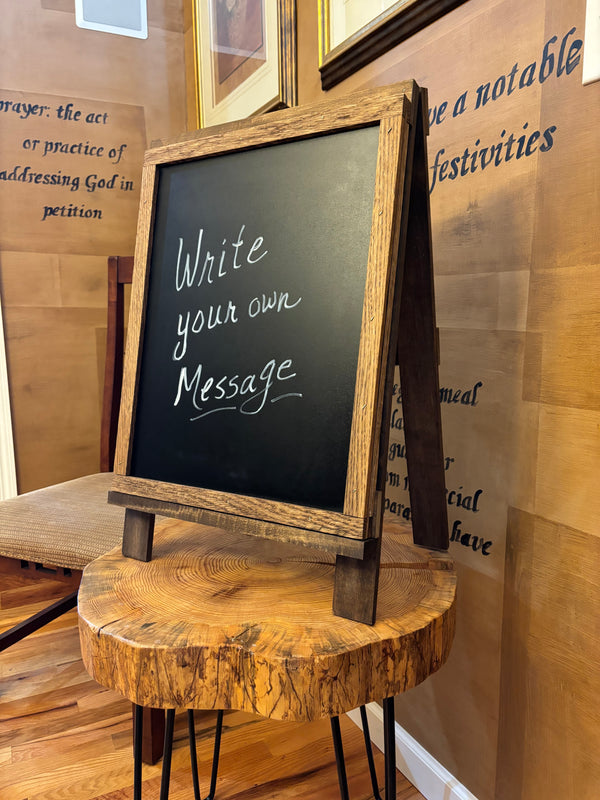 Side angle view of rustic tabletop easel with chalkboard