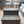 Dark stained 2-step wooden stool in a cozy bedroom setting, farmhouse style pet steps.