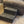 Handmade wooden 2-step stool in vintage dark stain next to recliner, rustic pet or toddler step.