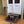 Handmade wooden dog bed with medium brown stain and cozy blanket