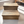 Rustic wooden 2-tier pet steps in Early American stain placed on light tile floor with natural sunlight.