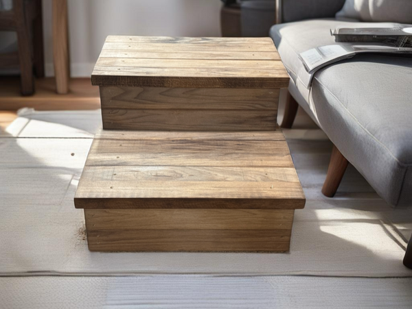 Handcrafted Early American wooden pet stairs in front of modern sofa on light rug.